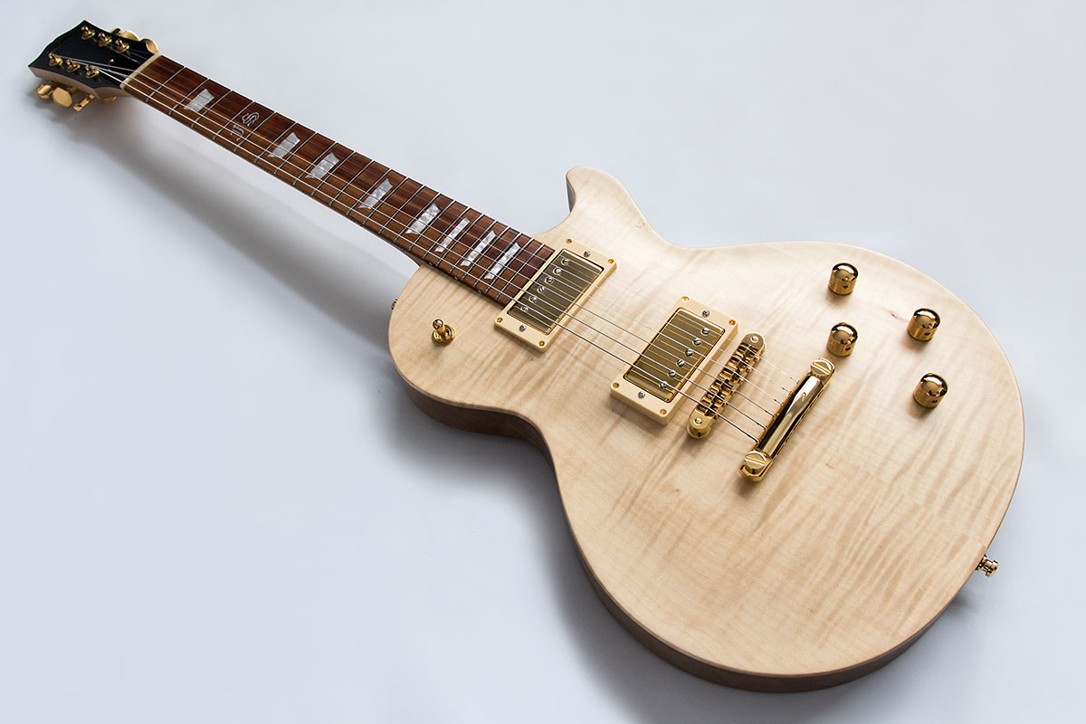 FS Custom handgebaute E-Gitarre im Les Paul Design. Natürliches Holz Finsih mit goldener Hardware.
